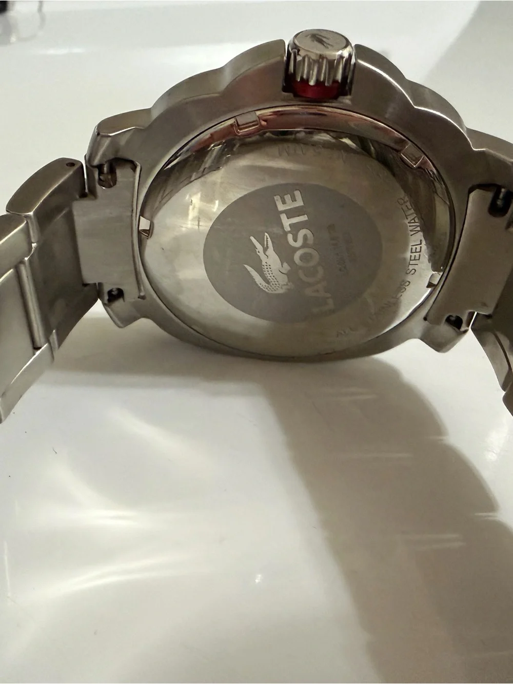 Lacoste Silver Stainless Steel Watch with Black Dial and Red Accents